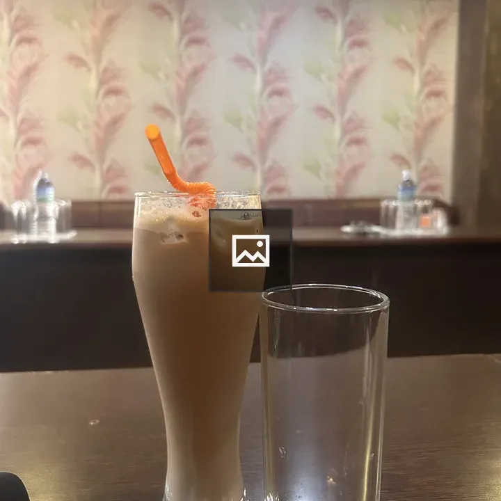 Iced coffee glass with straw