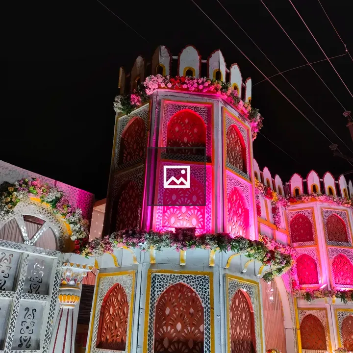 Decorative building with flowers at night