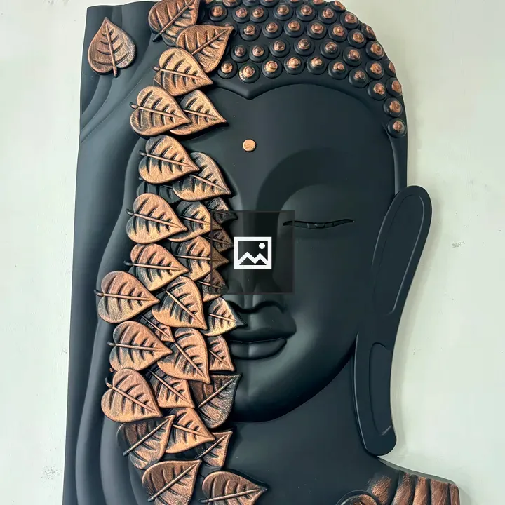 Buddha face with leaf motifs