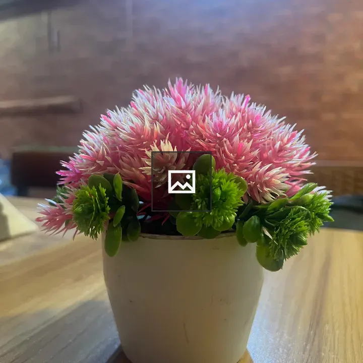 Pink Plastic Flower in White Pot
