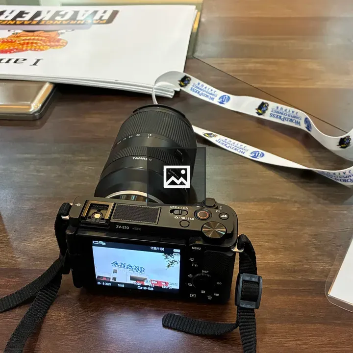 Camera on Wooden Table with Items