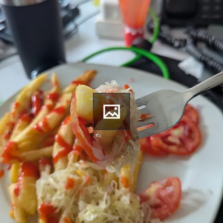 Fork with potato fries and cabbage