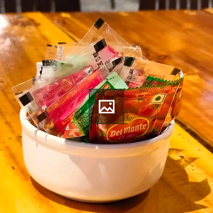 Bowl of pizza spices and ketchup