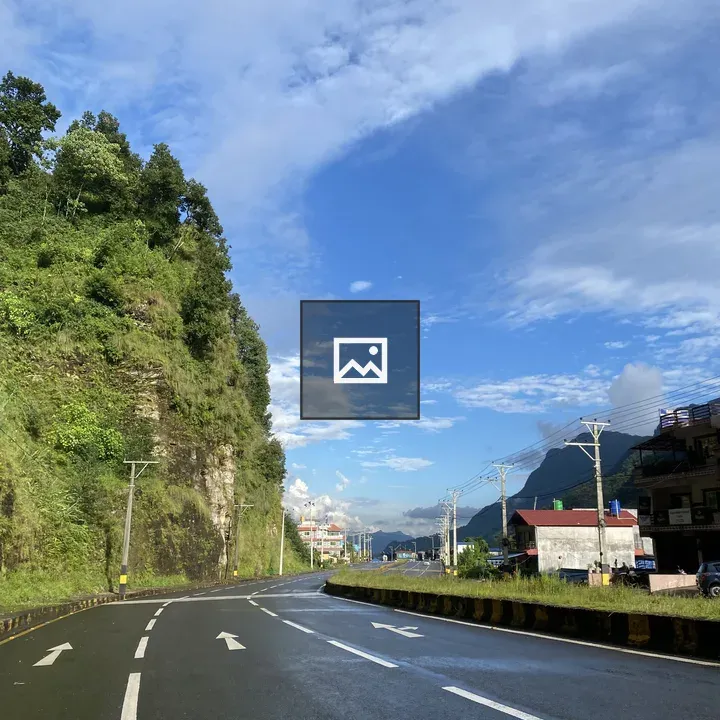 Scenic road with cliff and mountains