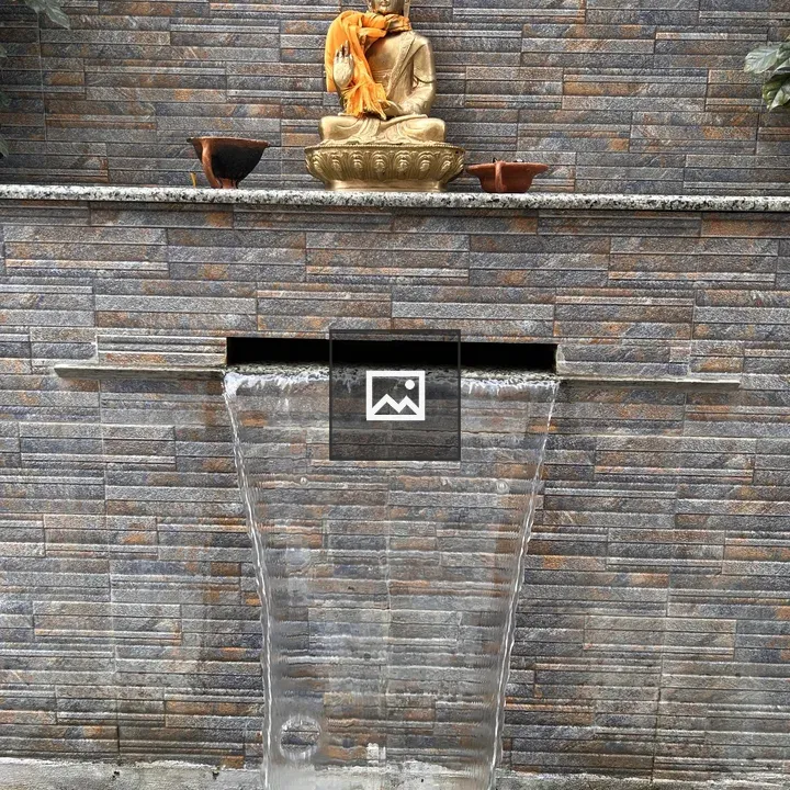 Golden Buddha statue with orange cloth