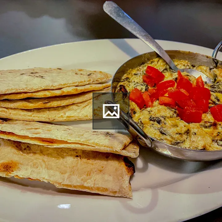 Spinach artichoke dip with pita chips