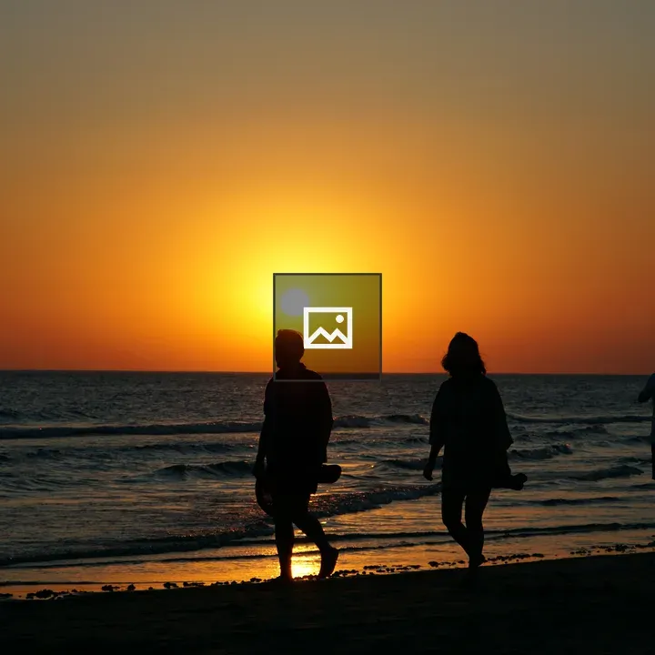Silhouetted Figures at Sunset Shore