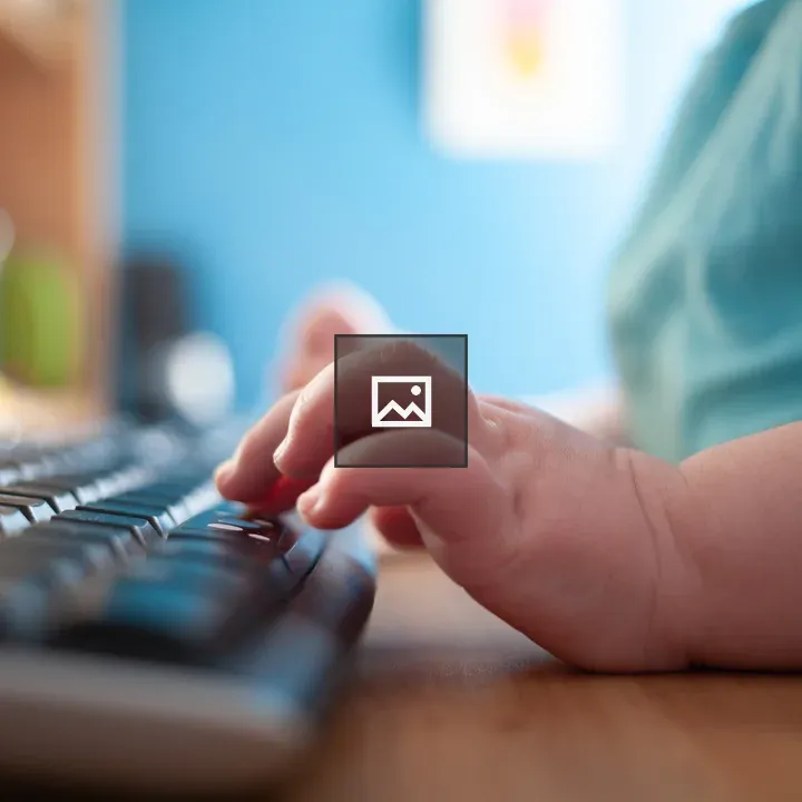 Childs Hands Typing on Keyboard
