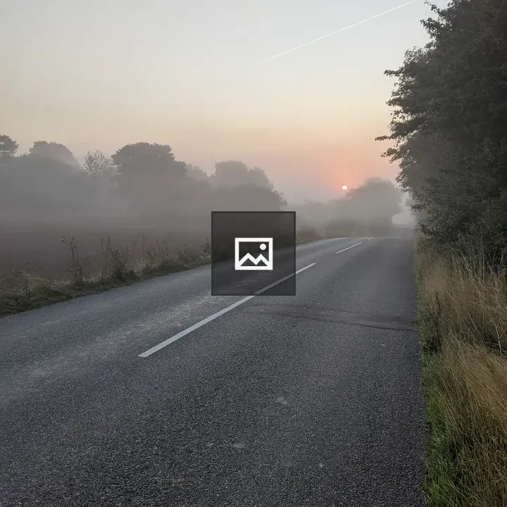 Foggy sunrise road