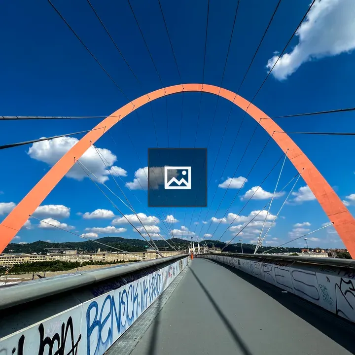 Red arch over Torino pedestrian bridge