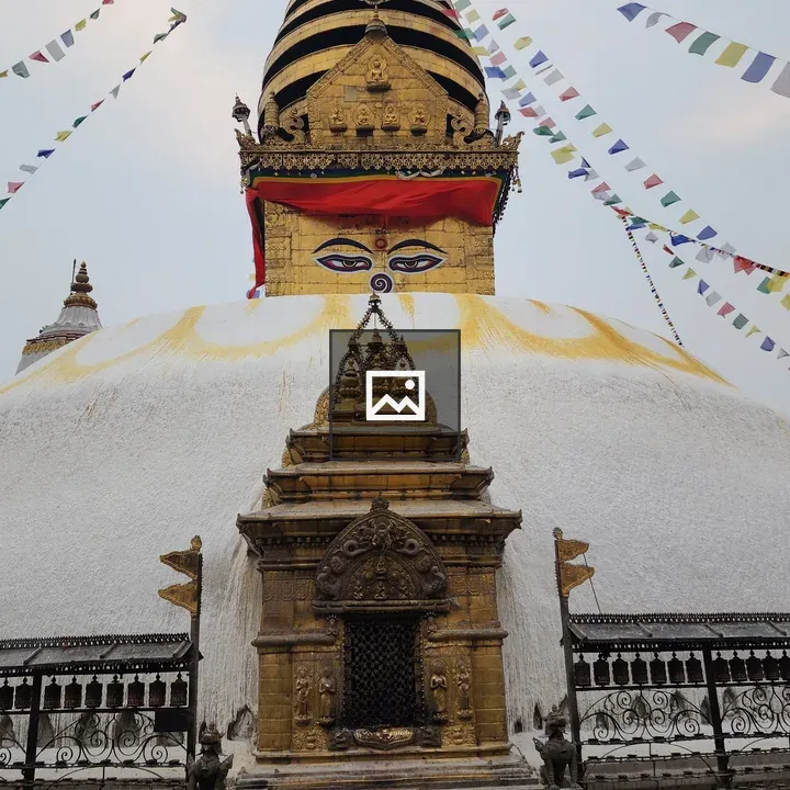 Stupa with Buddha Eyes and Flags
