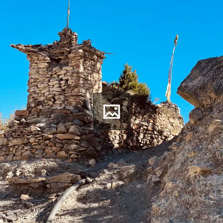 Ancient stone structure on rocky hillside