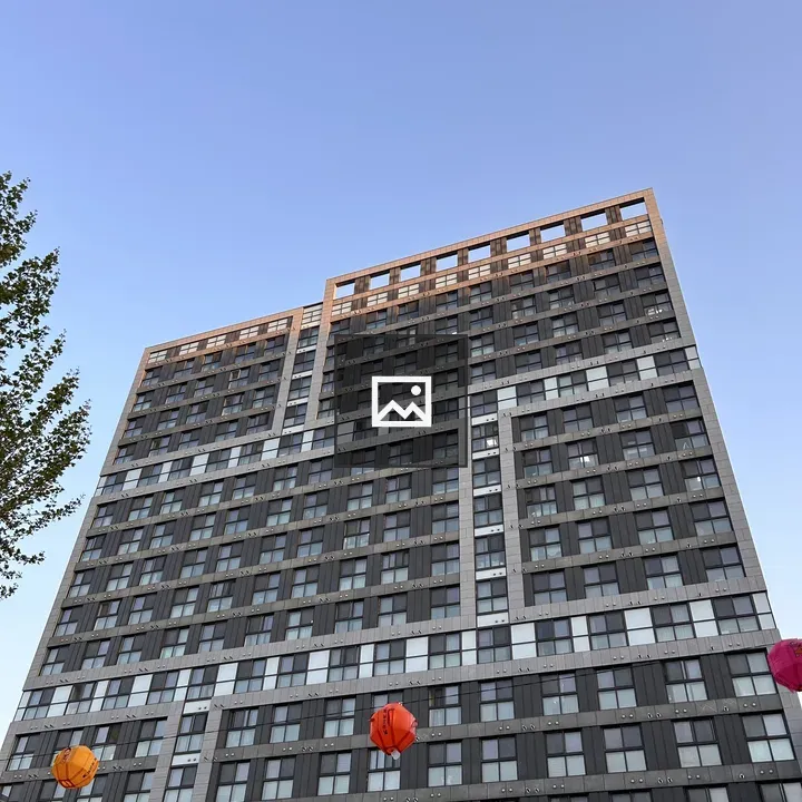 Tall modern building with blue sky