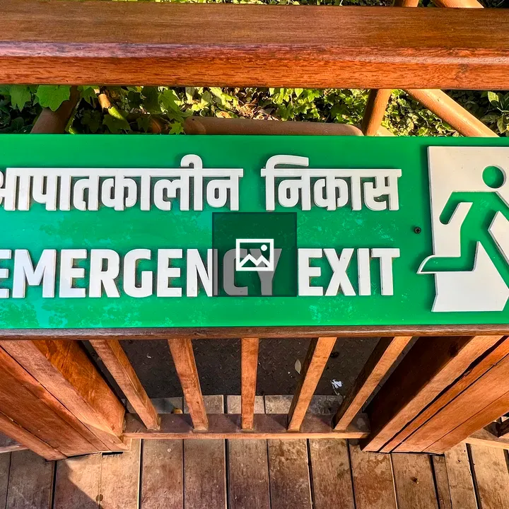 Emergency exit sign on railing