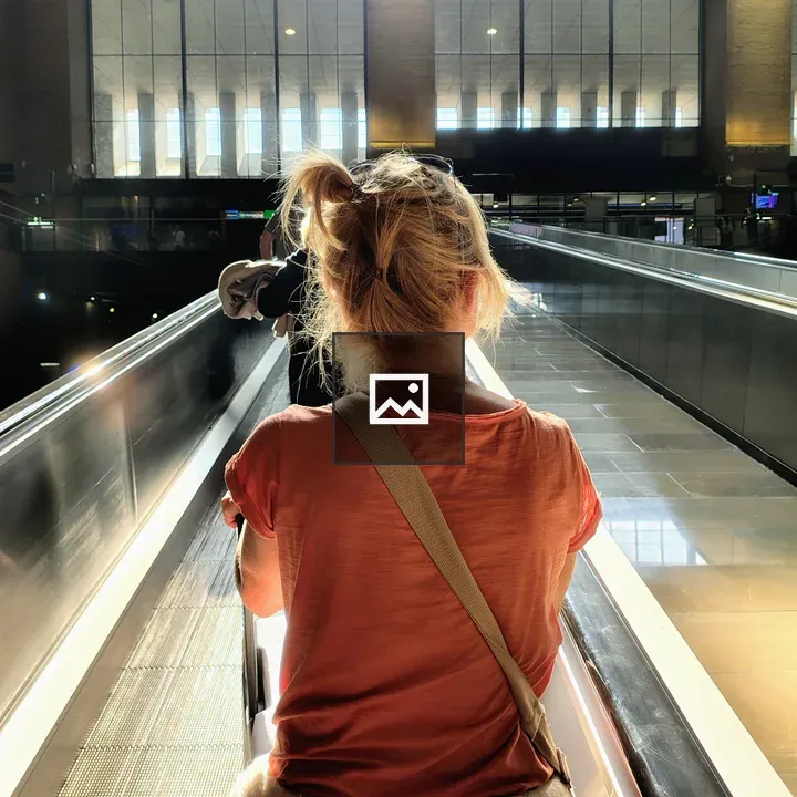 Woman on Moving Walkway