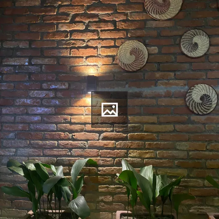 Brick wall with woven baskets and planters