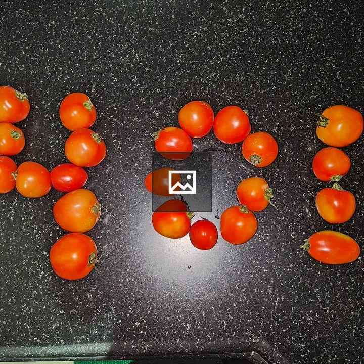 Tomatoes arranged as 401 on counter