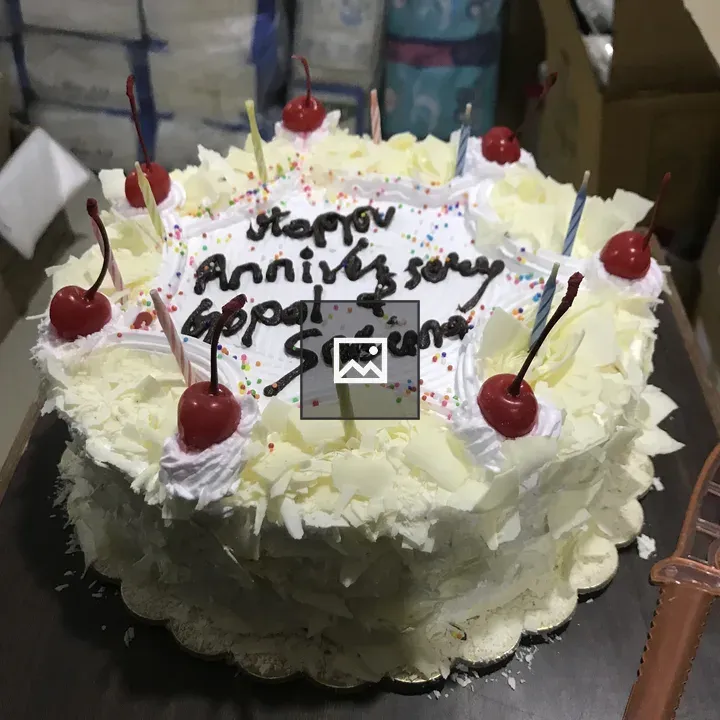 Circular White Anniversary Cake