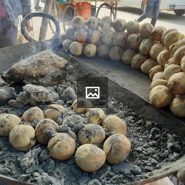 Potatoes in Ash-filled Cooking Pan