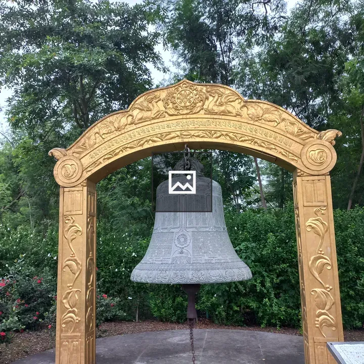 Ornate Bell Under Gold Archway