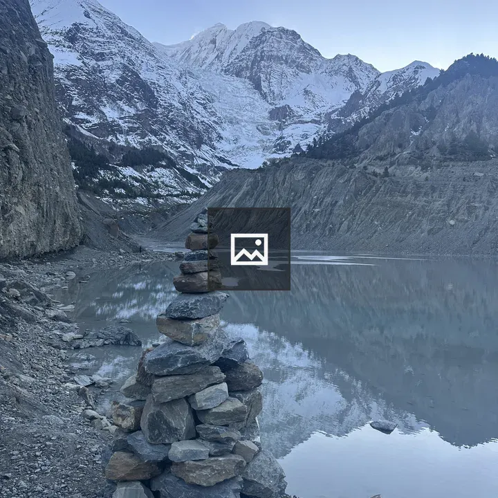 Stack of flat stones by lake