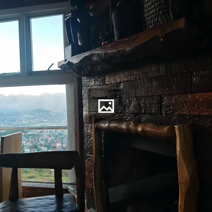 Rustic fireplace room with chair