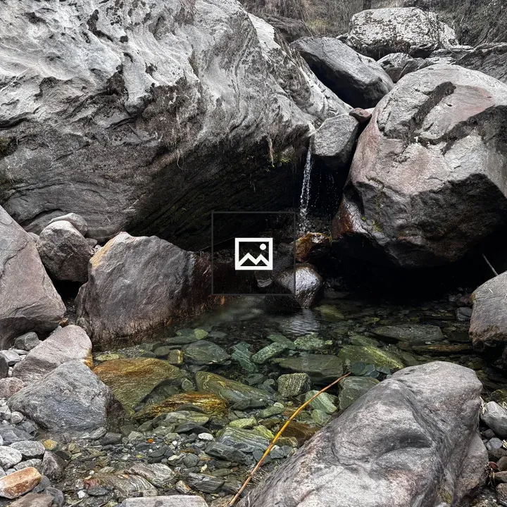 Rocky landscape with boulders and pool
