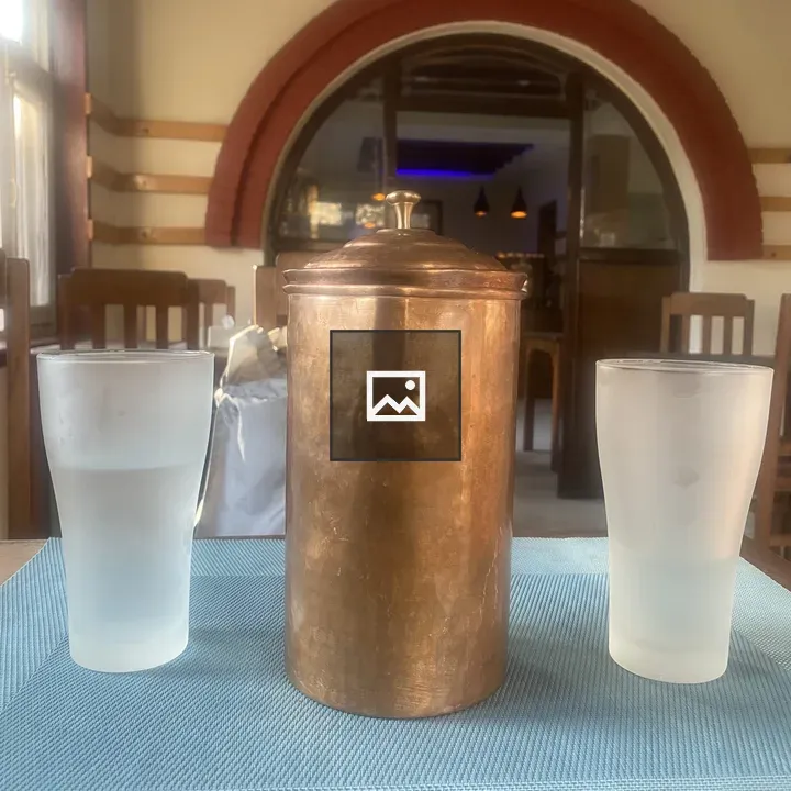 Copper container on blue mat