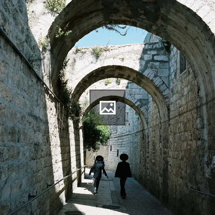 Two kids on St. James Street arch