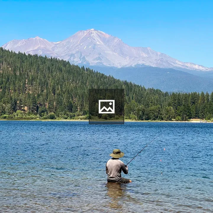 Angler by a Blue Lake
