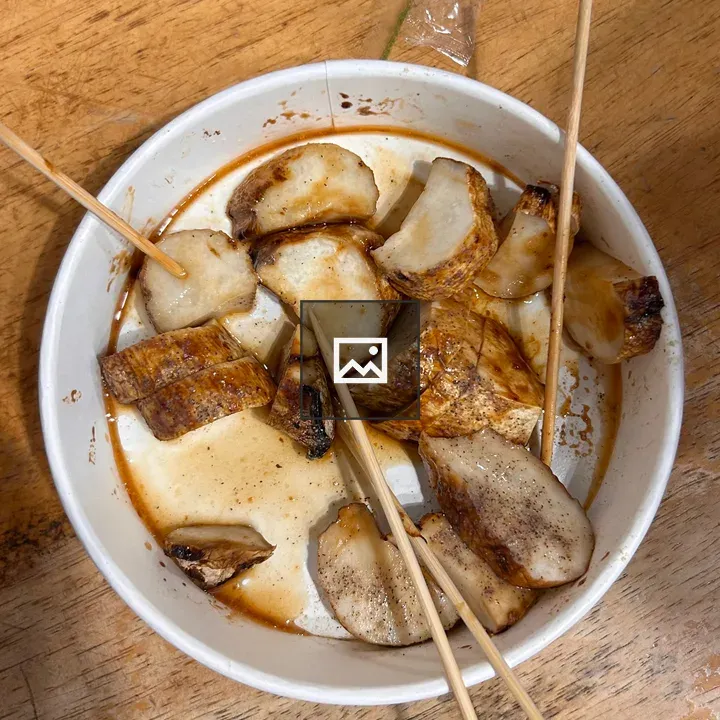 White bowl with grilled fish pieces