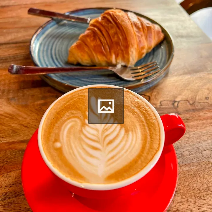 Latte and Croissant on Table