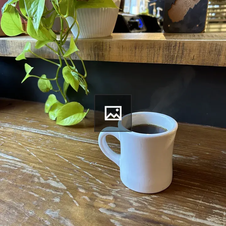 Cup of Coffee and Money Plant