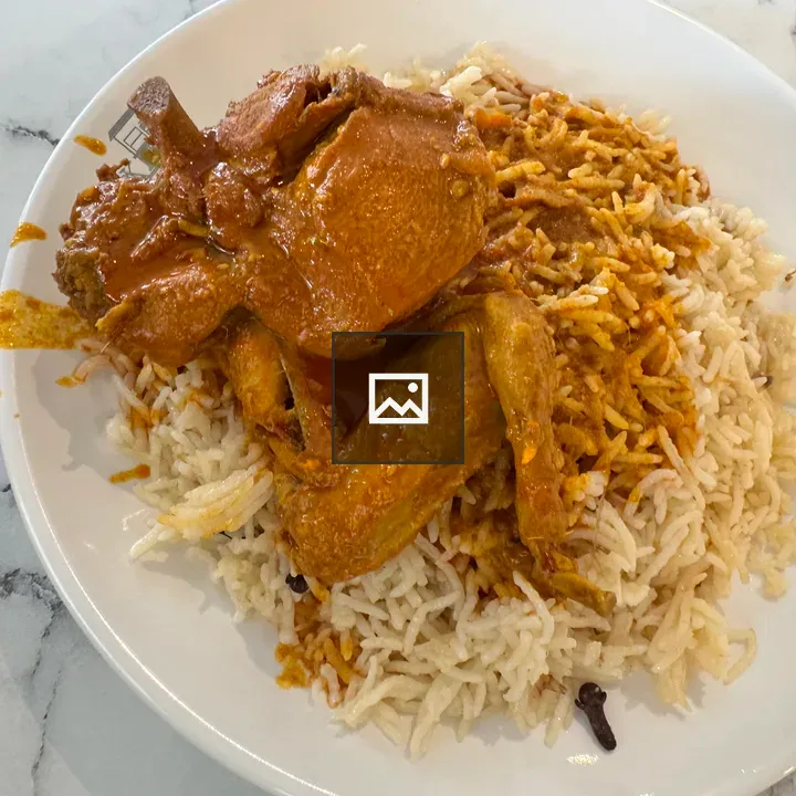 Rice and chicken in orange sauce