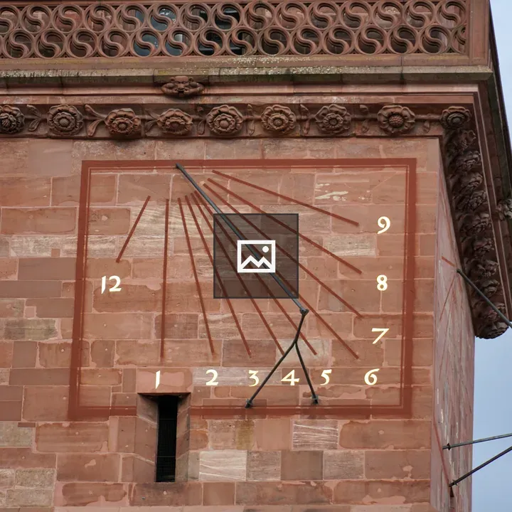 Historic sundial on stone wall
