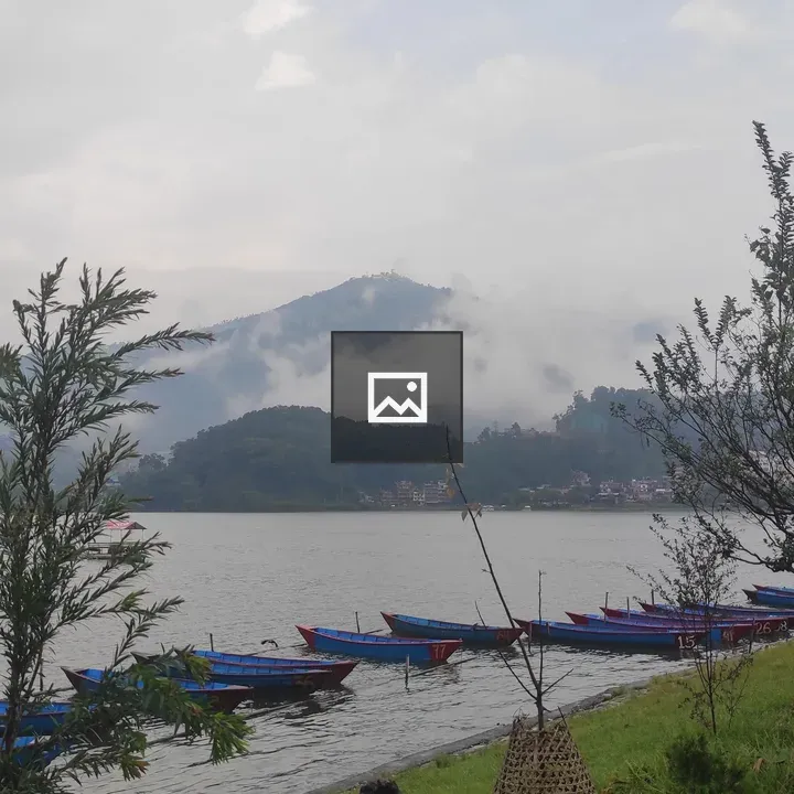 Blue and Red Canoes by Lake