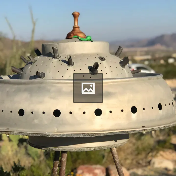Old rusty UFO sculpture