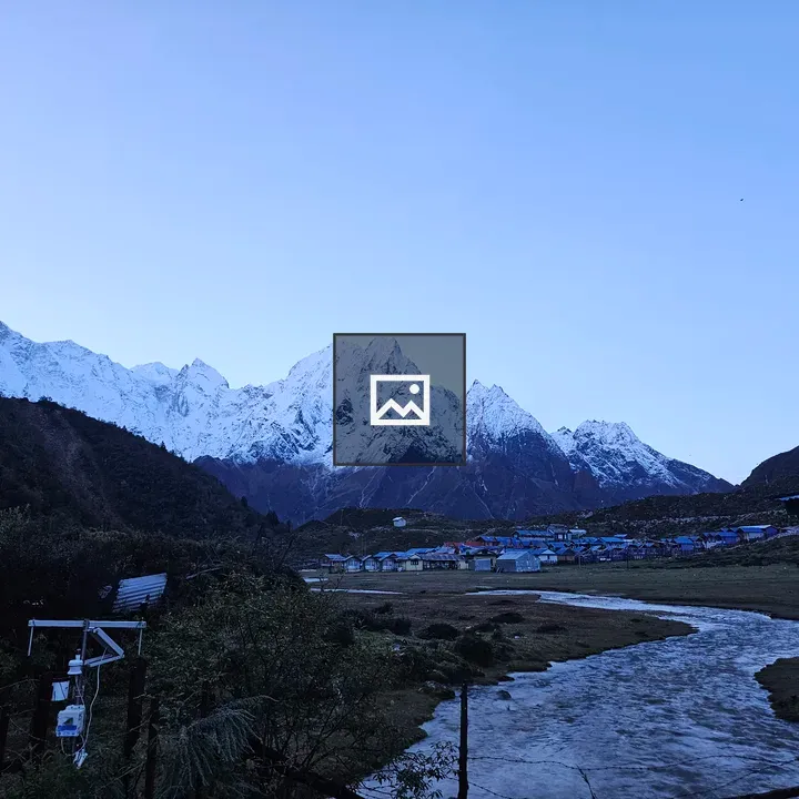 Dawn over snow-capped mountains