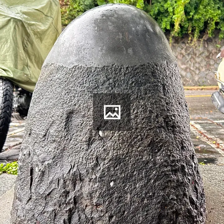 Stone dome sculpture on pavement