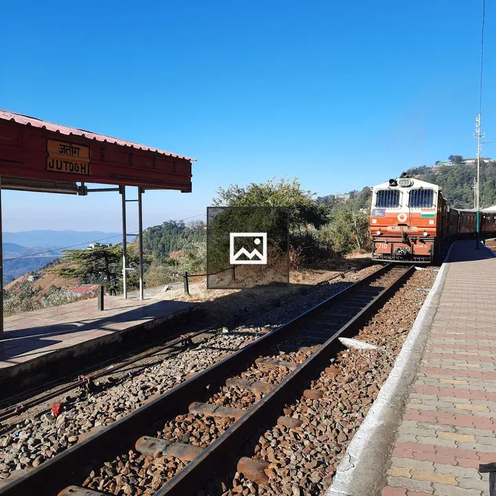 Railway station with approaching train