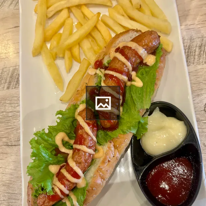 Hot dog with fries on plate