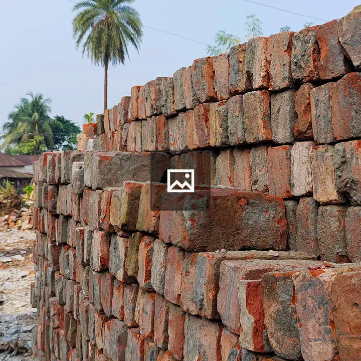 Brick stack beside date tree