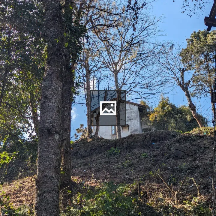 Small white house on hillside