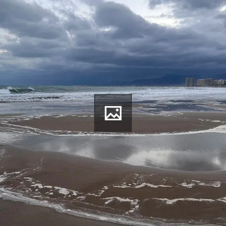 Heavenly clouds over beach and water