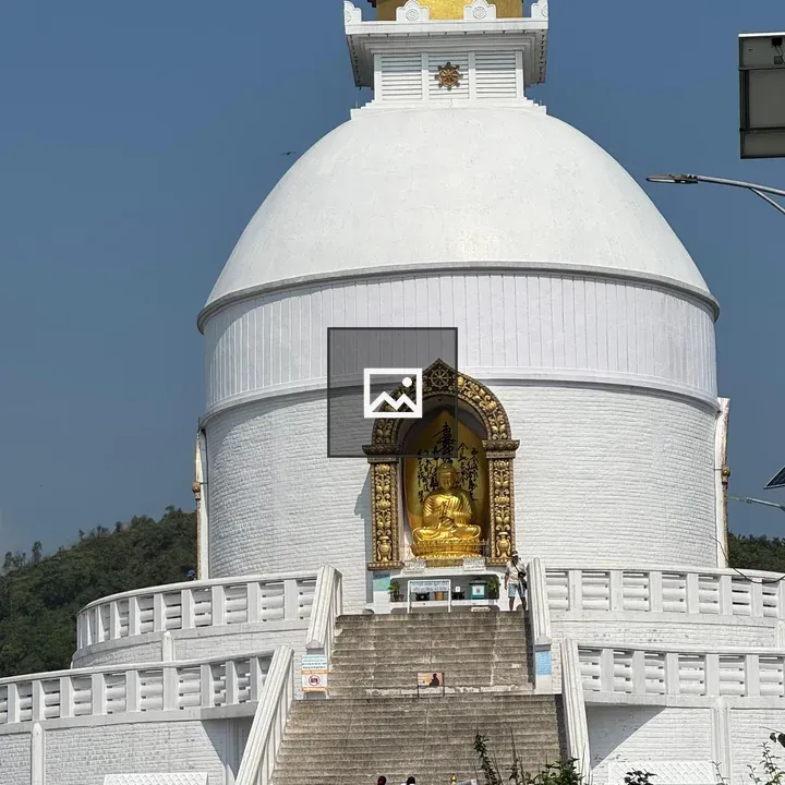 White stupa with Buddha statue