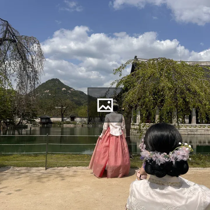 Two women in hanbok by the water