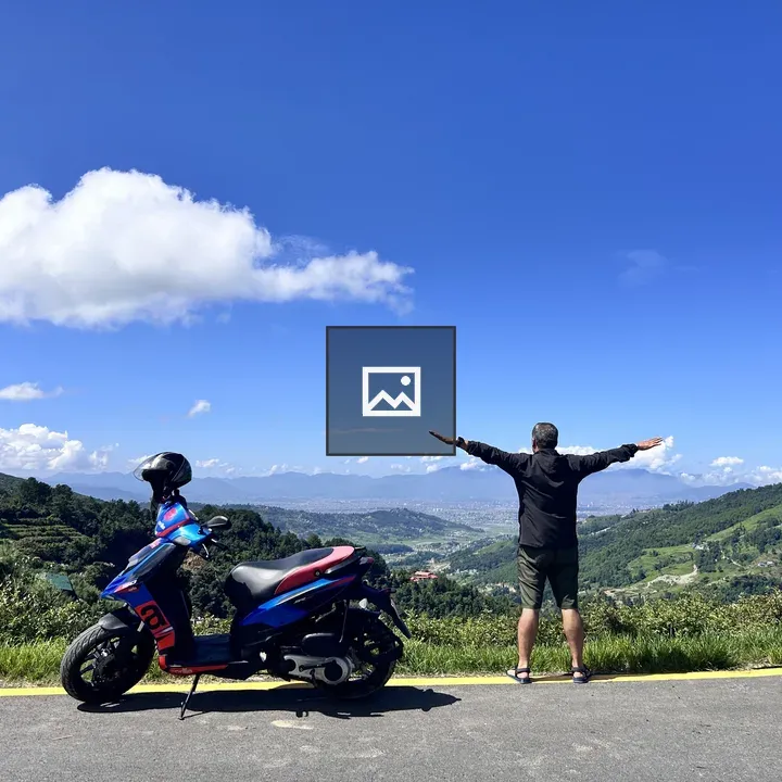 Person with Arms Outstretched Next to Motorcycle