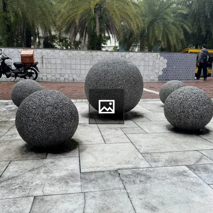 Gray Stone Spheres on Walkway