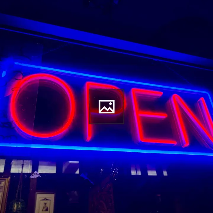 Open neon sign in restaurant window