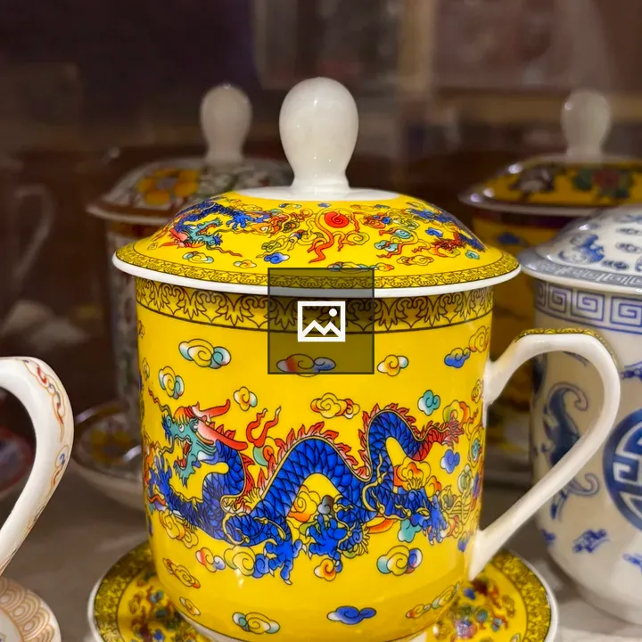 Yellow lidded mug with blue dragon